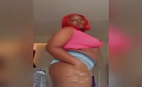 Twerking and oiled boobies on fat thot